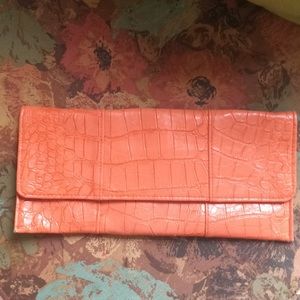 Orange reptile textured clutch